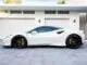 White-Ferrari-luxury-car-images-near-parking-area