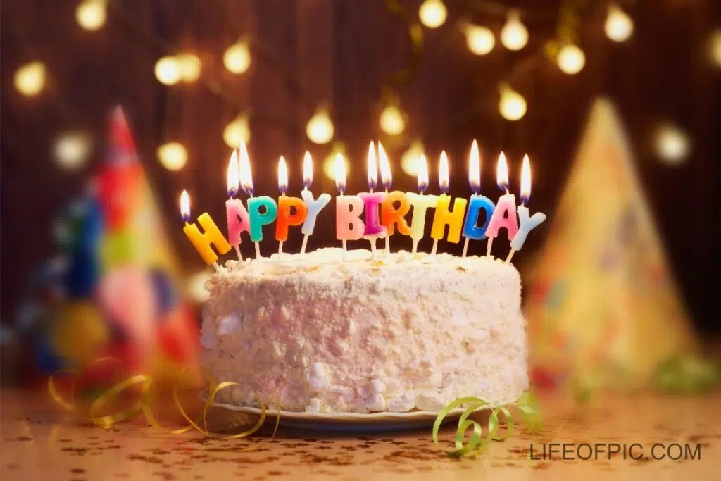 Birthday cake with candles bright lights bokeh - Free birthday cake images