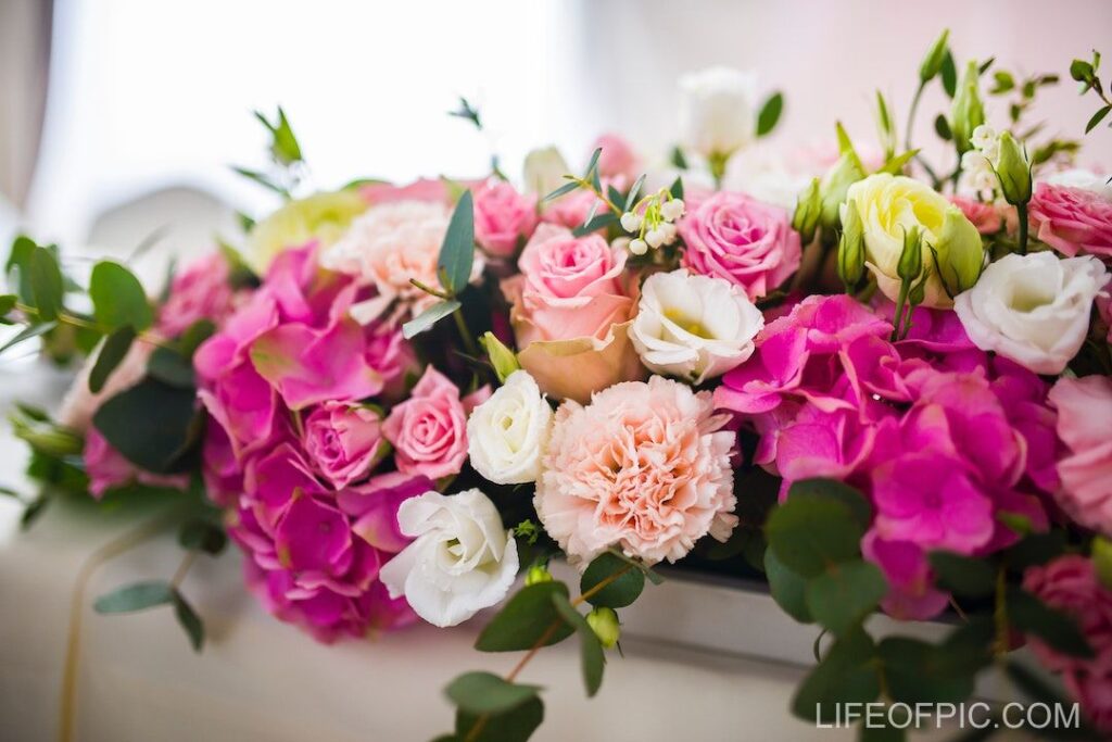 Bouquet of fresh flowers in white vessel - flower images