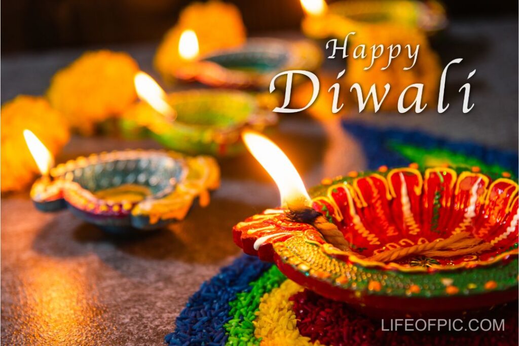 Close up clay lit light a fire already on Diya or oil lamp with flowers on concrete background