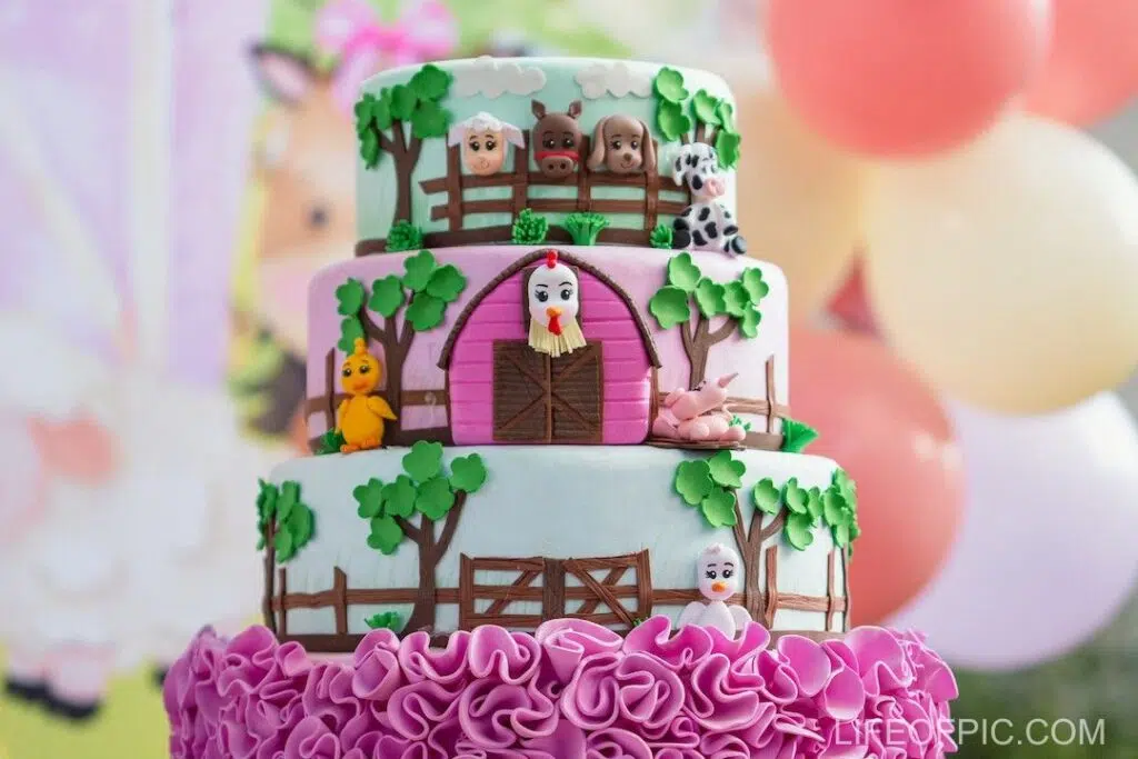 Pink and White Cake With Balloons
