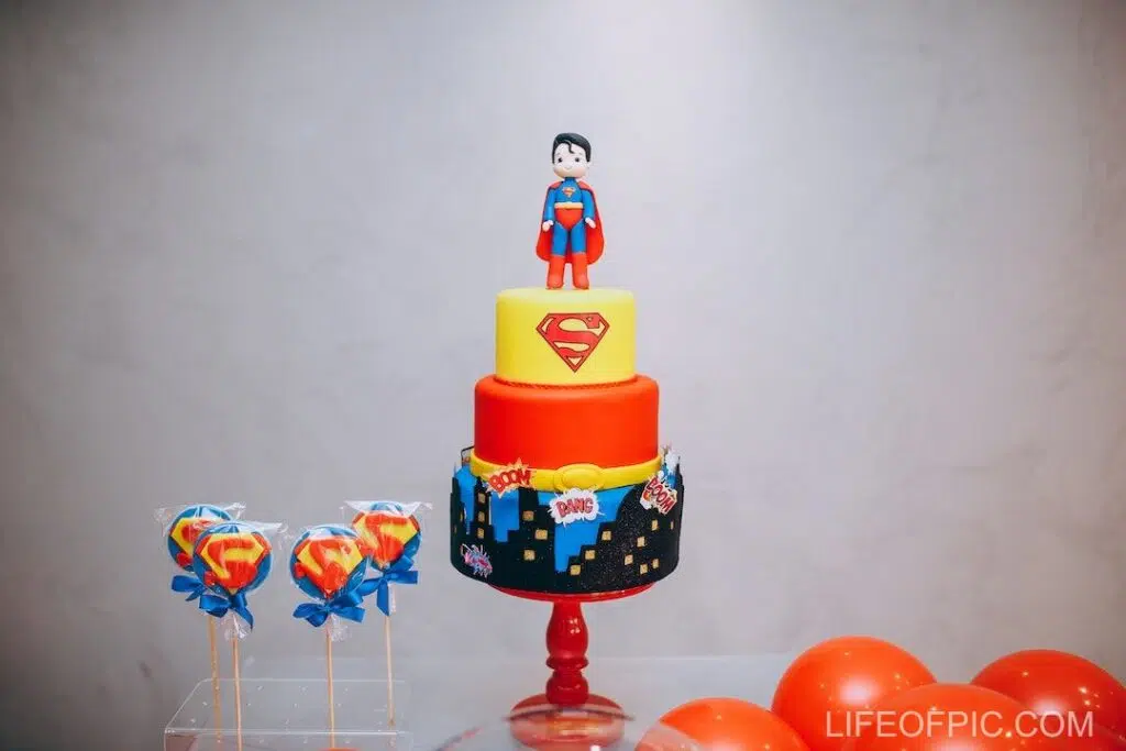 Yellow Red and Blue Cake with Superman Topper