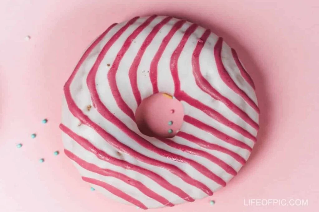 Close Up of a Red and White Donut - Donuts Images