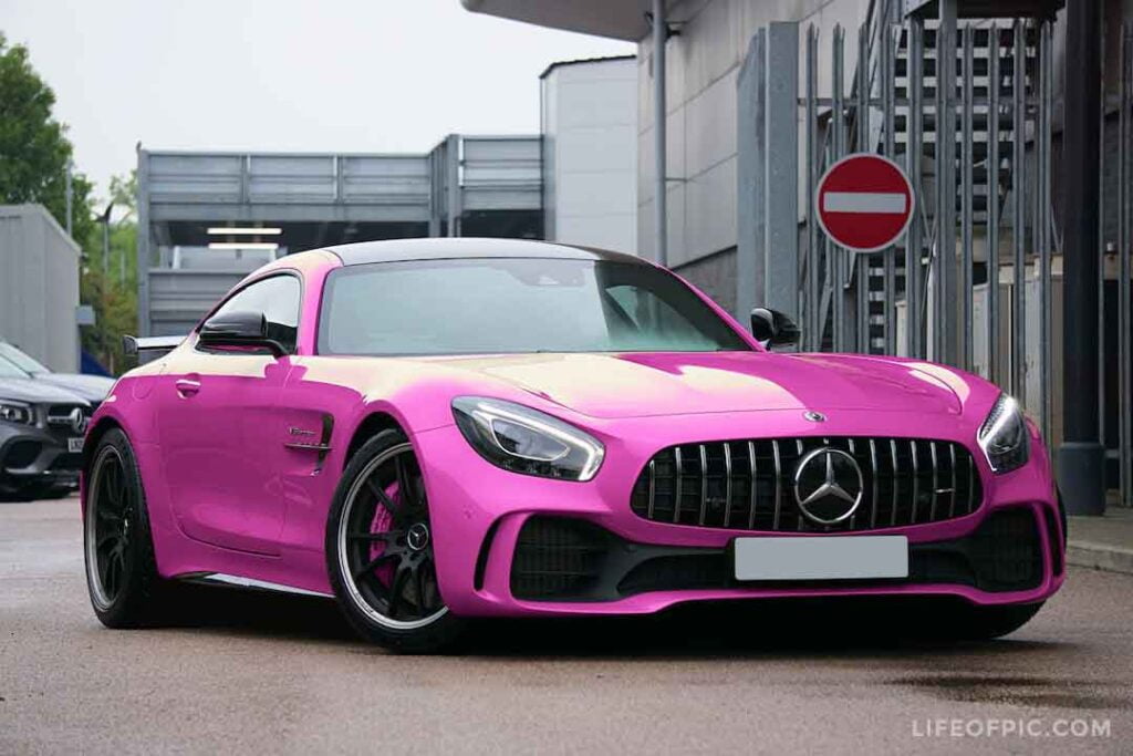 Pink Mercedes Benz Luxury car on the Road -