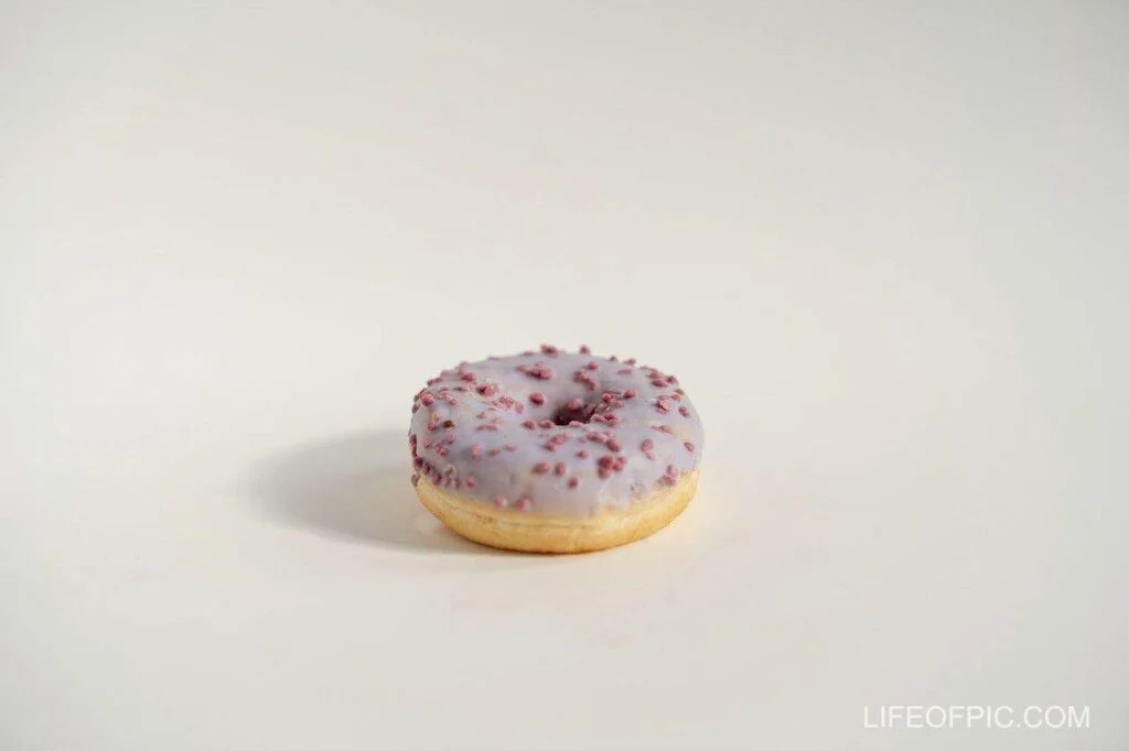 Purple Brown Doughnut on White Table - Donuts Images