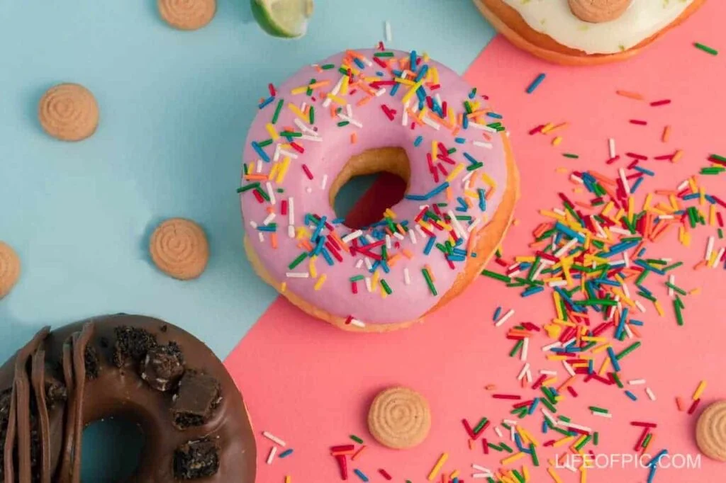 Sprinkles on a Pink Donut - Donuts Images