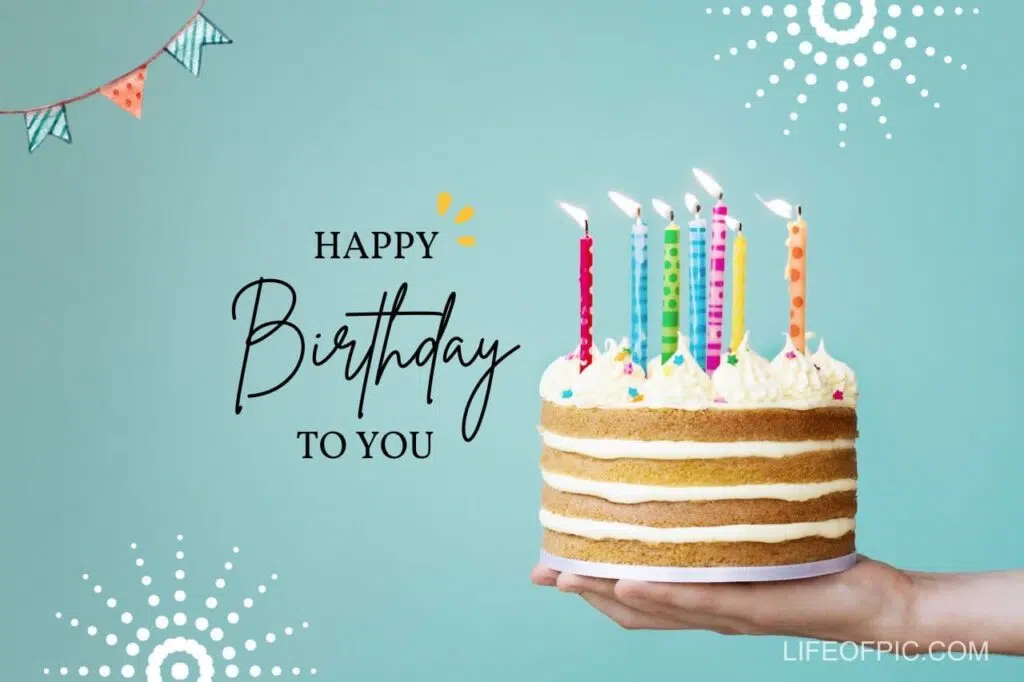 A Hand Holding A Cake With Candles - Free birthday cake images