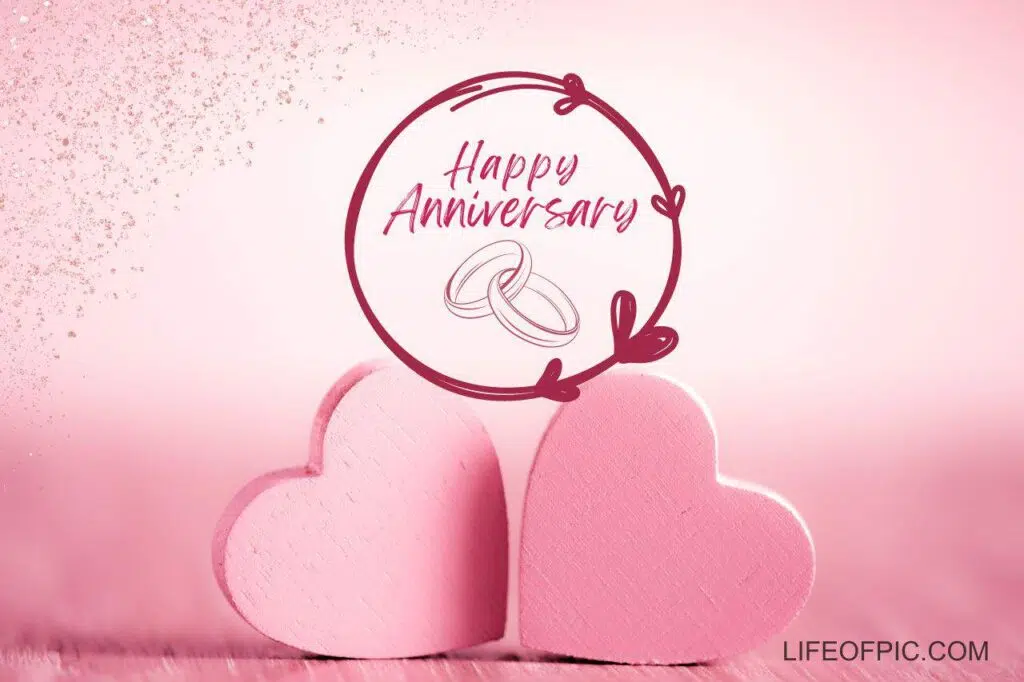 A couple of pink hearts with a happy anniversary - happy anniversary images